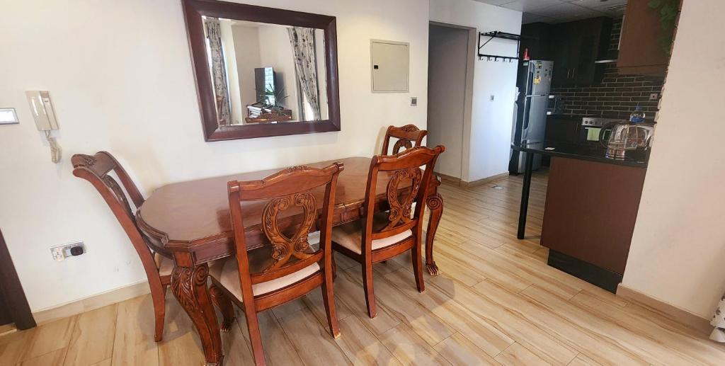 Huge studio with full kitchen, dining table, living area, and sofa bed — photo 2